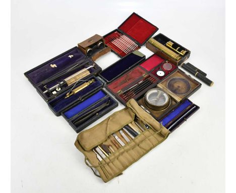 A mixed collection of scientific, dental and medical instruments, including scalpel set, brass microscope, etc.