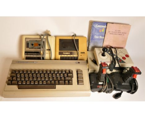 A Commodore 64 (serial No WGB 70246), with manual, a Commodore Datassette (serial No 413954), a Turbo Datacoder (model No DM-