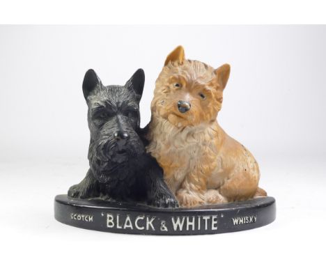 A Scotch Whiskey 'Black &amp; White' advertisement figure, flatback, rubber, 20cm x 26cm