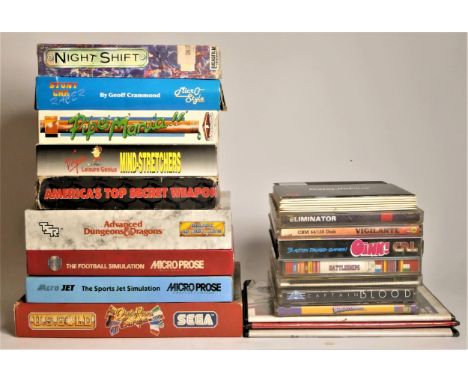 A collection of twenty six Commodore 64 5 1/4 inch floppy disk and cartridge games, including :Eliminator (case and insert)Ad