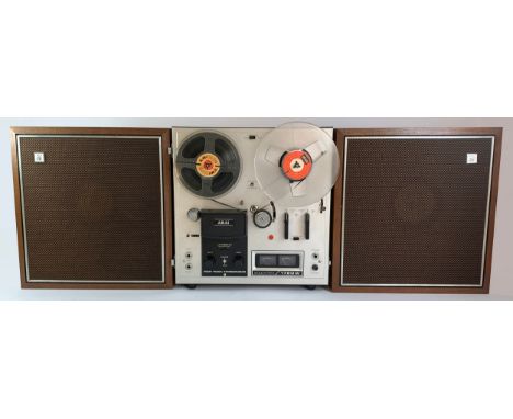 A AKAI Model 1720W Four Track Stereophonic Solid State reel to reel player, two ADM8 microphones, AH-6 head demagnetizer, cab
