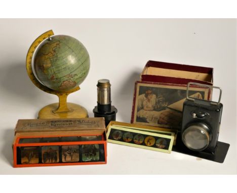 A pocket lamp magic lantern, with lens and stand, with slides of children's stories, boxed, together with a set of Primus mag