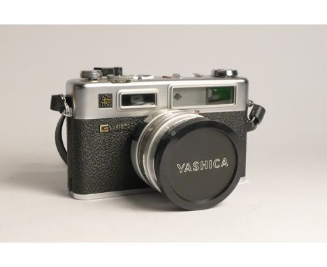 A Yashica Electro GS 35 rangefinder 35mm film camera, cased, with a 45mm f1.7 lens, also including two rolls of Kodak Colorpl