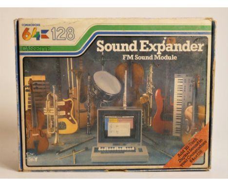 A Commodore 64 sound expander FM sound mudule, AV cabke, casette, manual and original box 