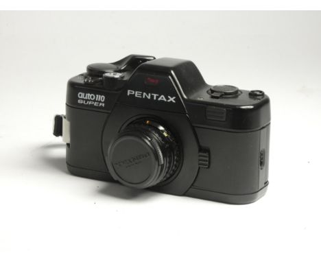 A Pentax Auto 110 Super film, camera, cased, with a Pentax 110 24mm f2.8 lens, a Pentax 110 18mm f2.8 lens, a Pentax 110 50mm