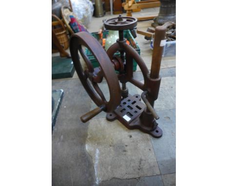 A cast iron table top drill 