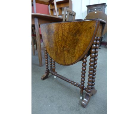 A Victorian figured walnut bobbin turned Sutherland table 