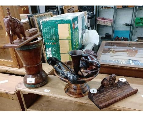 Vintage wooden mortar, along with other tribal carved wood