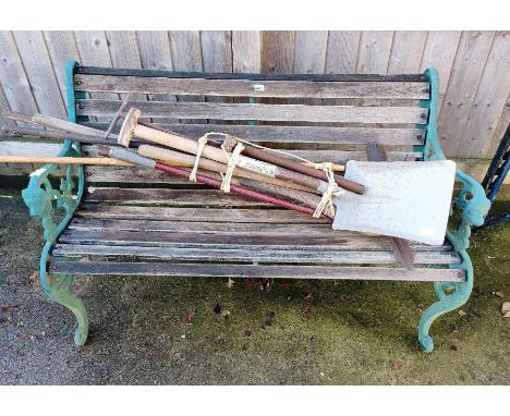 Garden bench seat along with a bundle of garden hand tools