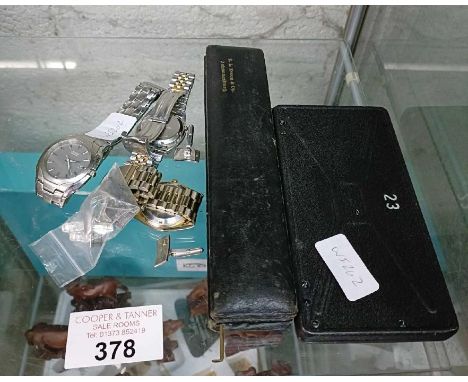 Gentlemen's wrist watches along with precision tools