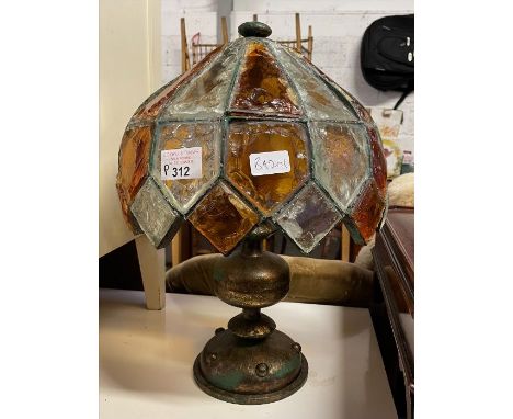 A 20th century lamp with a glass shade