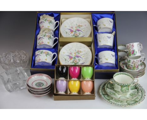 A cased set of six Coalport exotic bird decorated coffee cups and saucers, along with six Anchor China Indian Tree pattern co