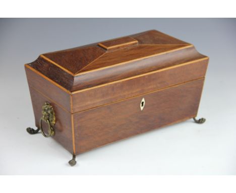 A Regency snake wood tea caddy, of sarcophagus form, enclosing two internal canisters and mixing box, on claw and ball feet, 