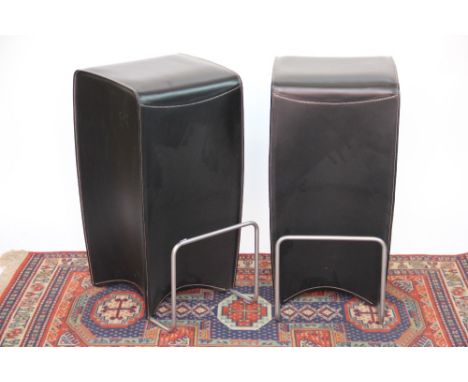 A pair of modern stitched leather stools, with metal foot rests, 75cm H, with a leather and chrome rectangular wall mirror, 7
