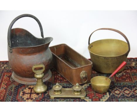 A Berry & Warmington 7lb brass weight, a brass preserve pan, sauce pan, a copper coal scuttle, a planter and a brass double i