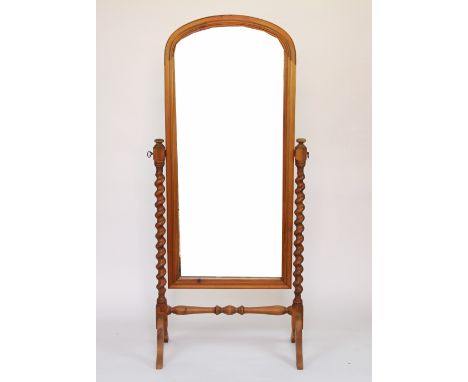 A modern pine cheval mirror, with barley twist uprights, on scroll legs, 154cm