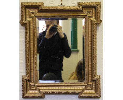 A late 19th century giltwood and gesso rectangular mirror, with bevelled plate, 58cm x 48cm