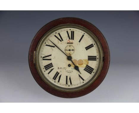 A Great Eastern Railway wall clock, by Smiths, with Roman numeral dial marked 'BR(E) 11799', with subsidiary seconds, brass b