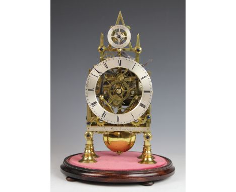 A late 19th century gilt brass fusee skeleton clock with silvered Roman numeral chapter ring above a silvered plaque signed '