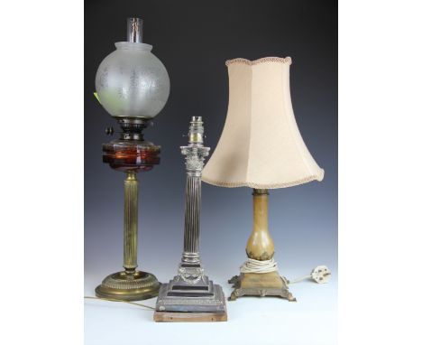 A Victorian large silver plated lamp base in the form of a fluted column with Corinthian capital, raised on stepped square ba