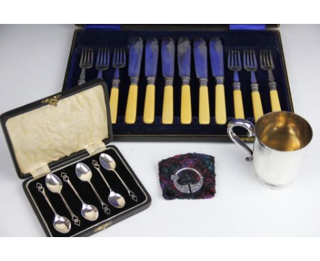 A cased set of six Art Deco silver coffee spoons, A J Bailey, Birmingham 1942, along with a cased set of six fish knives and 