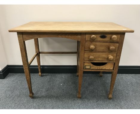 A mid-20th century child's desk fitted four drawers