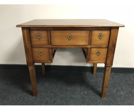 A continental mahogany lady's desk fitted five drawers