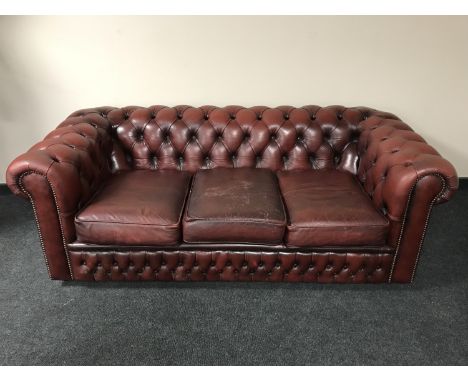A red button leather Chesterfield three seater settee 