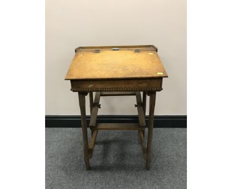 A mid-20th century child's school desk with inkwell