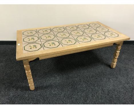 A blond oak tile top coffee table