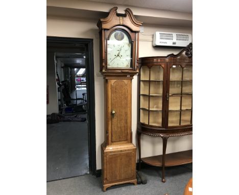 An early 19th century oak longcase clock with painted dial, Thomas Corker of Stafford with pendulum and weights  