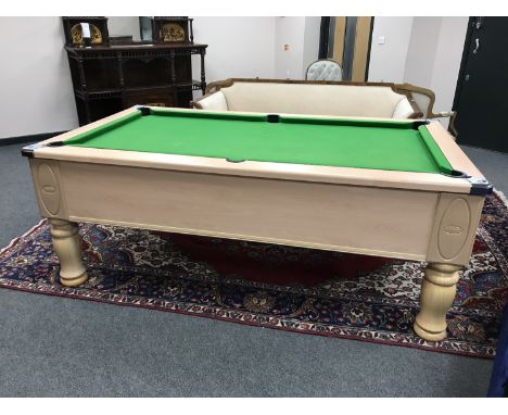 An Ascot 6' pool table, slate bed, not coin operated, complete with novelty 8-Ball cue stand, twelve cues, one set of pool ba