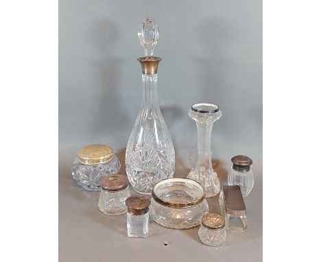 A cut glass decanter with Birmingham silver collar together with a gass spill vase with silver rim and seven silver mounted d