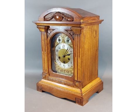 An Edwardian walnut mantle clock with a brass dial, silvered chapter ring with Arabic numerals and two subsidiary dials 