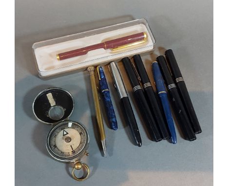 Four fountain pens by Osmiroid together with other pens and a brass compass 