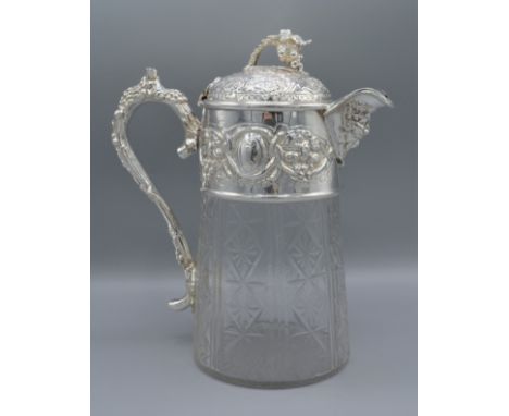 A silver plated and cut glass claret jug decorated with grape vine and figural spout, 26cms tall 