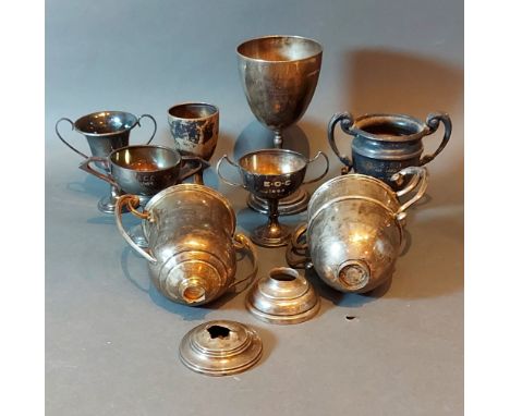 A Victorian London silver presentation goblet together with seven silver trophy cups, 23ozs 