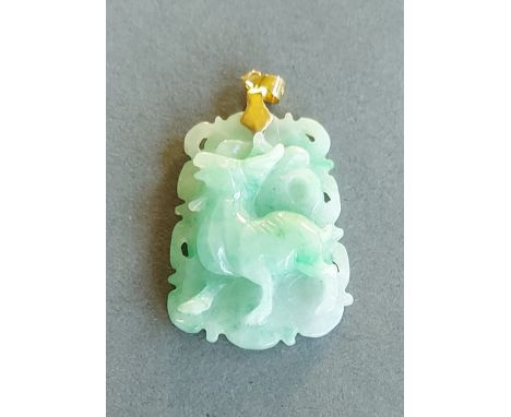 A Chinese jade pendant of pierced carved form, 4cms long 