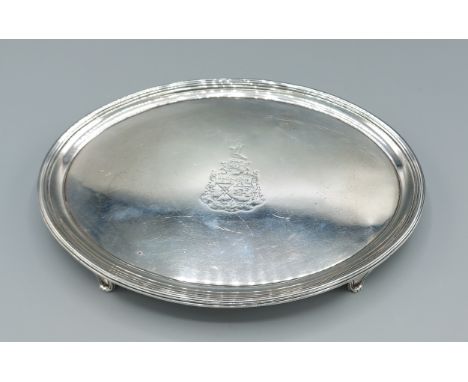 A George III silver waiter of oval form with four scroll feet, London 1800, makers John Crouch and Thomas Hannam, 15ozs, 25.5