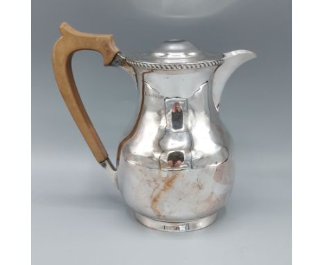 A Birmingham silver covered jug with shaped handle, 13ozs all in, 16cms tall 