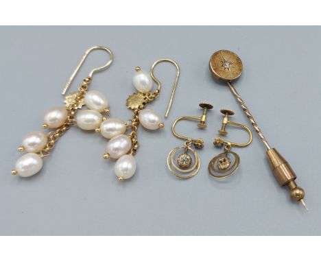 A yellow metal stick pin set solitaire diamond together with a pair of 9ct gold and pearl drop earings and a pair of 9ct gold