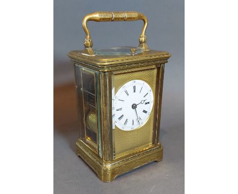 A French engraved brass carriage clock, the repeater movement with lever escapement together with leather outer case 