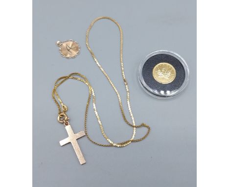 A Canadian 1/20th Gold dollar coin, 1.5 grams, together with a 10ct gold pendant and a 9ct gold crucifix pendant with chain, 