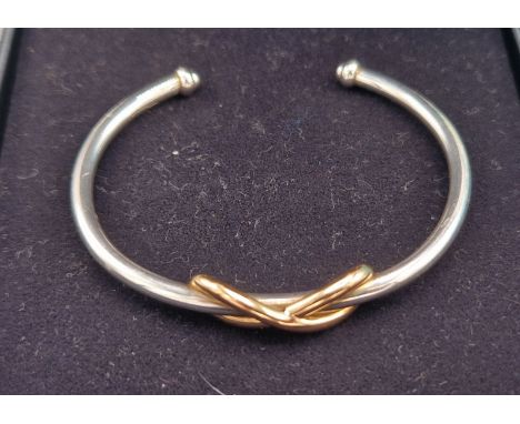 A Tiffany &amp; Co 925 silver and 18ct gold Infinity cuff bangle, 12.5gms 