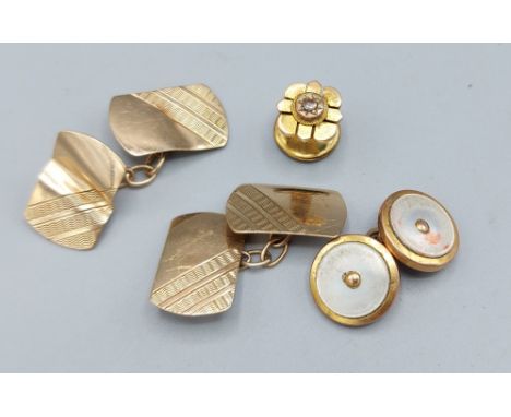 A pair of 9ct gold cufflinks, 3.2gms, together with  a 9ct gold and mother of pearl cufflink and a diamond set dress stud 