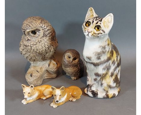 A Poole Pottery stoneware model of an owl by Barbara Linley Adams together with another similar smaller owl, two Banksome mod
