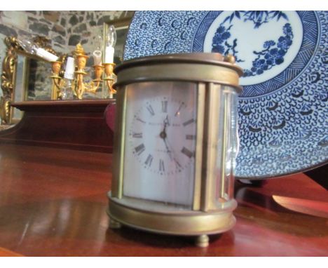 Victorian Carriage Clock of Oval Form Dial Inscribed Elliot And Son London With Original Key 4 Inches high