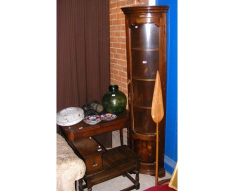 A 19th century fold-over table on turned supports, together with an inlaid corner cabinet and oak hall seat