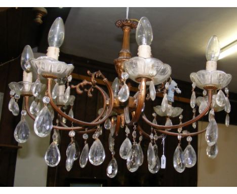 A decorative multi-branch crystal drop ceiling light