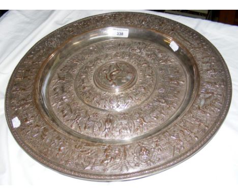 A 45cm diameter silver plated Elkington charger depicting classical scenes, having lozenge to back marked "V R Art Foundation